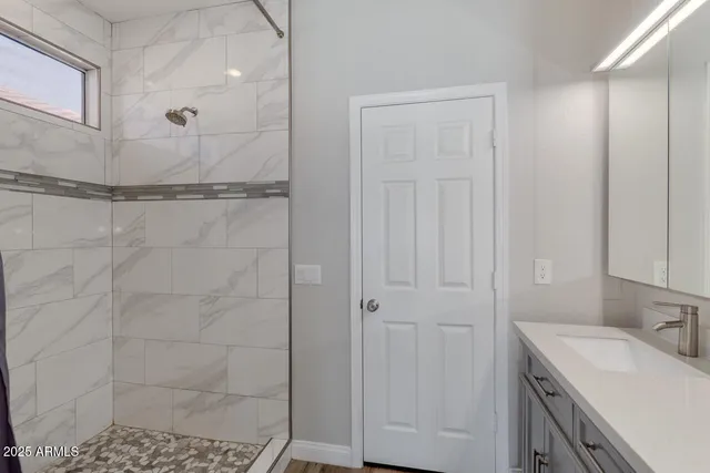 a bathroom with a sink and a mirror