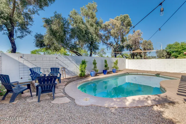 a view of outdoor sitting area with furniture and tub