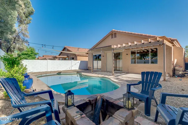 a view of a chairs and table in the patio