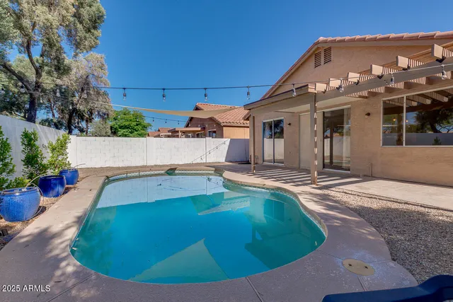 a view of a house with swimming pool