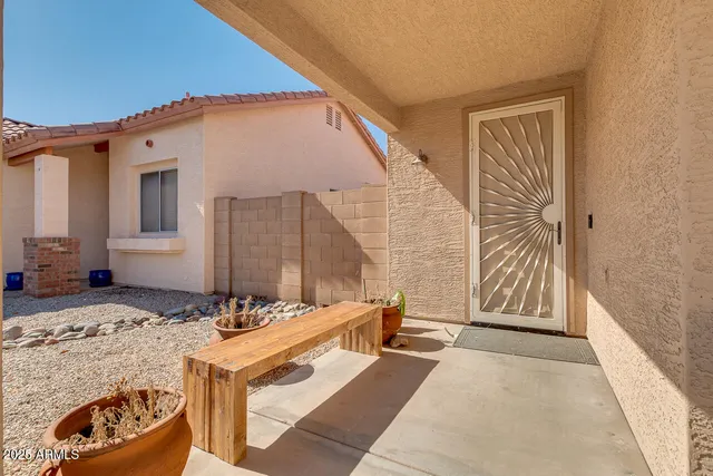 a living room with a bed and furniture