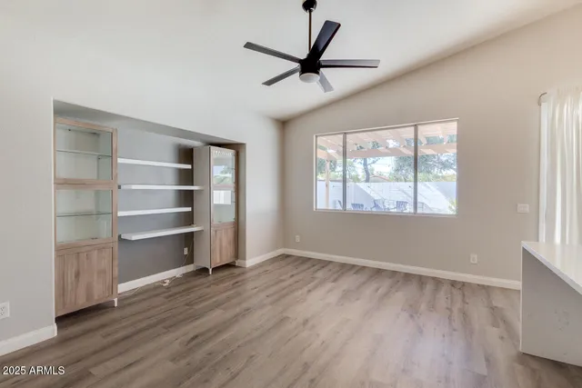 a view of a room with a cabinet and a window