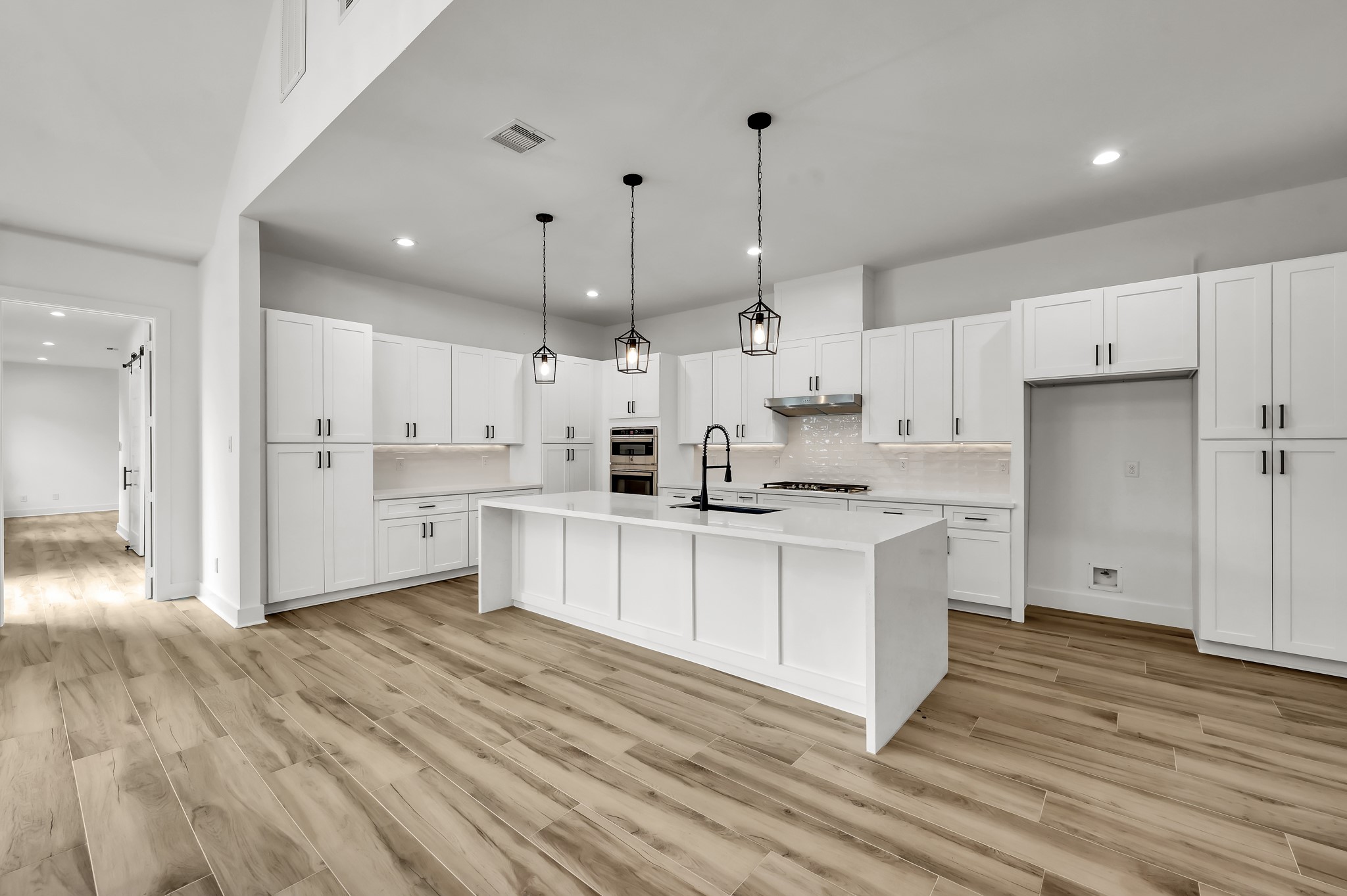 14742 Turquoise Trail Willis, TX 77378 - Photo 16 of 48 a kitchen with white cabinets and window