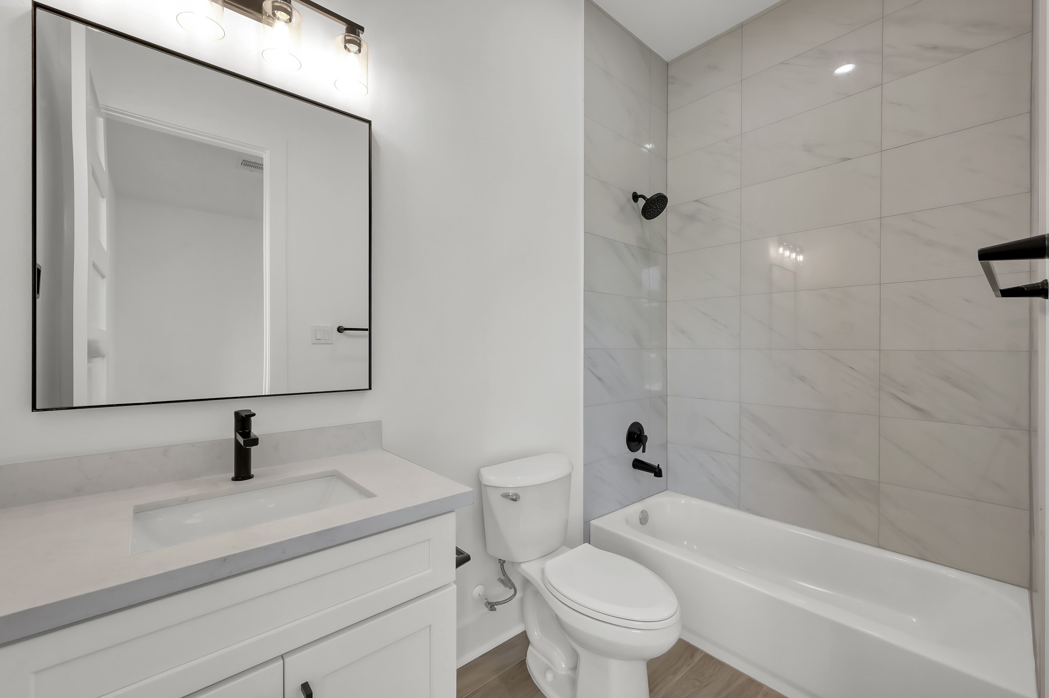 14742 Turquoise Trail Willis, TX 77378 - Photo 31 of 48 a bathroom with a sink a toilet and shower