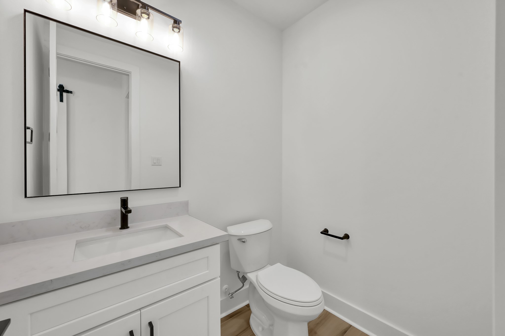 14742 Turquoise Trail Willis, TX 77378 - Photo 32 of 48 a bathroom with a toilet sink and mirror