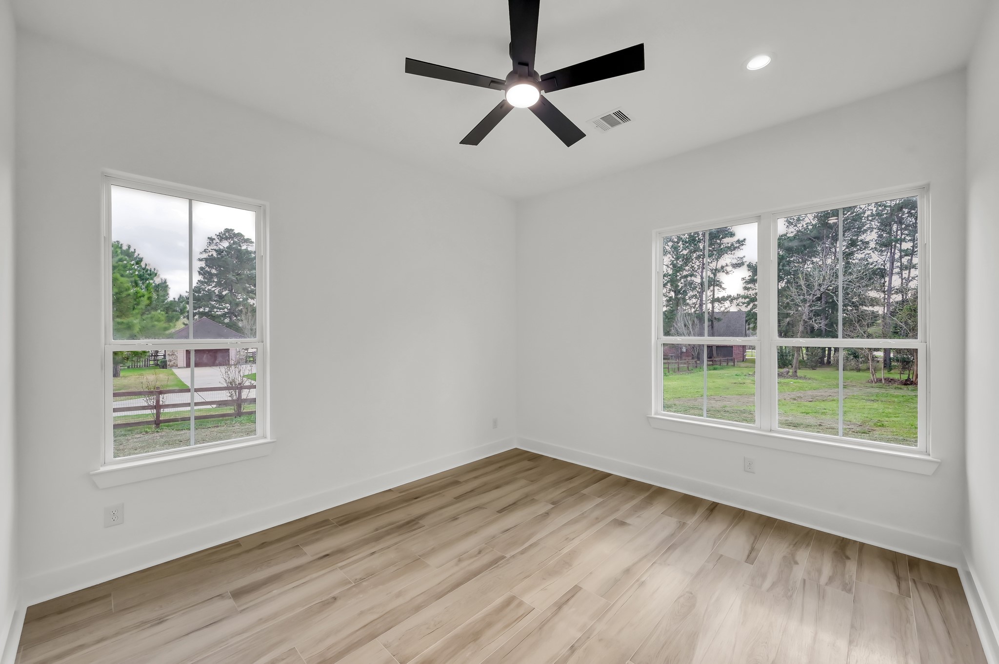 14742 Turquoise Trail Willis, TX 77378 - Photo 33 of 48 a view of a room with wooden floor and windows