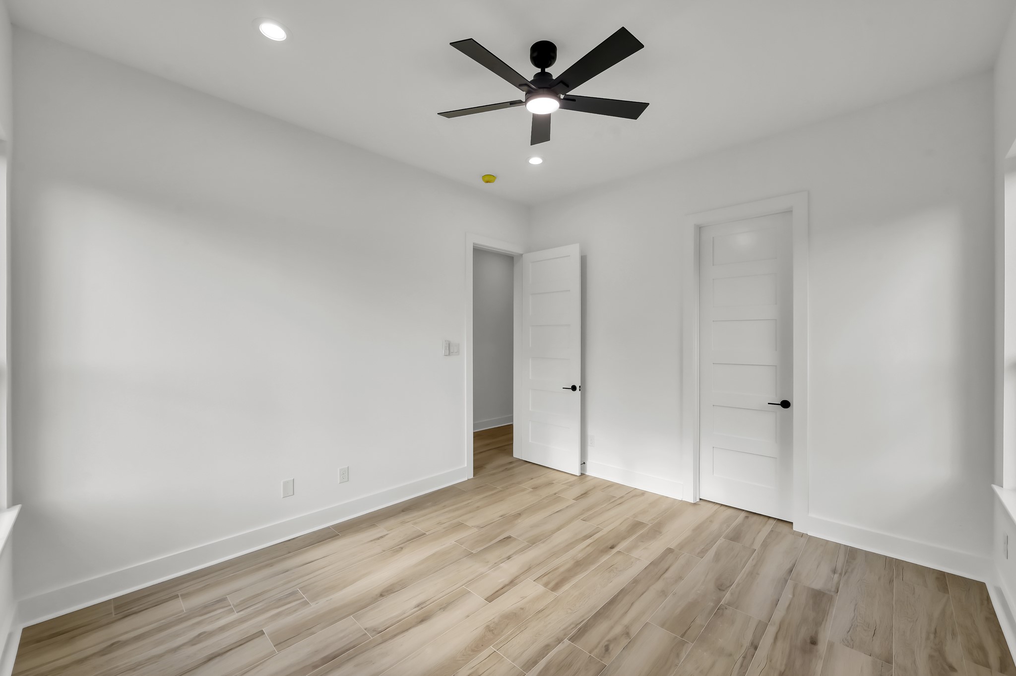 14742 Turquoise Trail Willis, TX 77378 - Photo 34 of 48 an empty room with wooden floor and ceiling fan