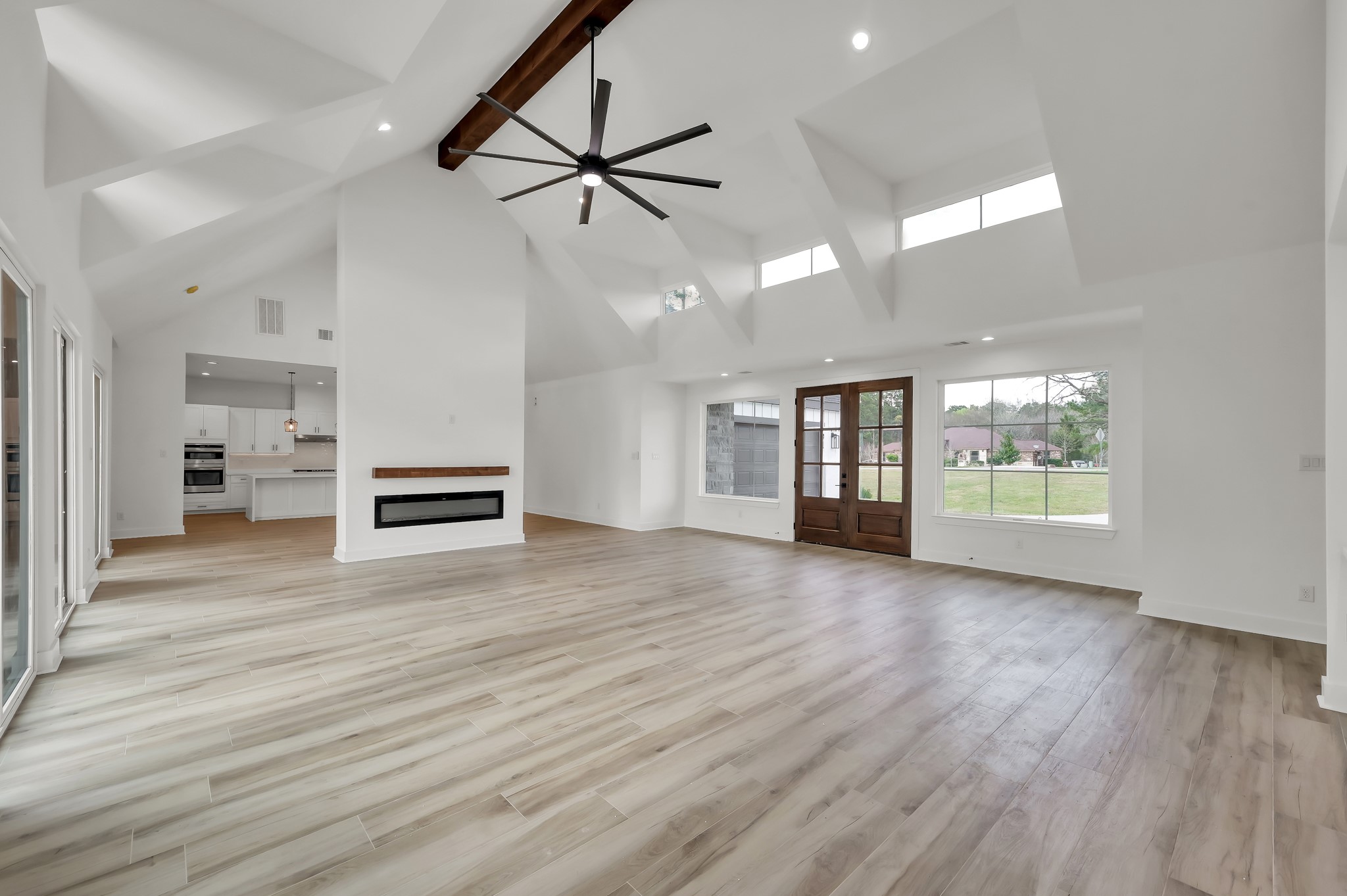 14742 Turquoise Trail Willis, TX 77378 - Photo 10 of 48 a view of an empty room with window and wooden floor