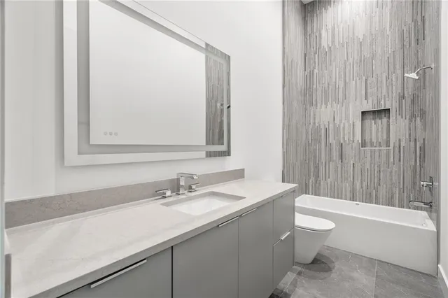 a bathroom with a sink a toilet and a bathtub