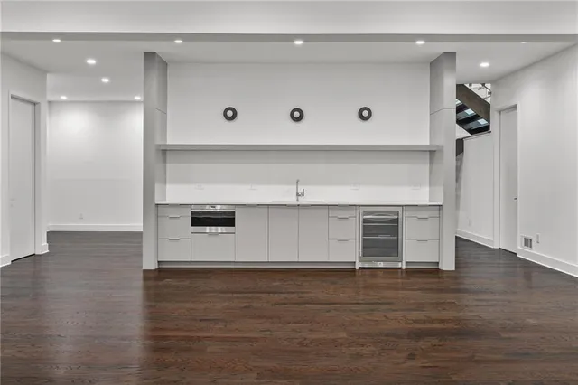 a view of kitchen and wooden floor