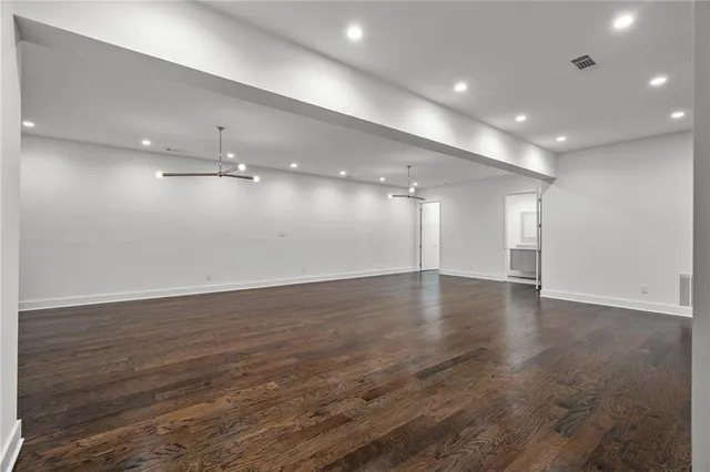 an empty room with wooden floor