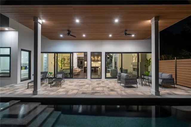 a room with wooden floor and outdoor view