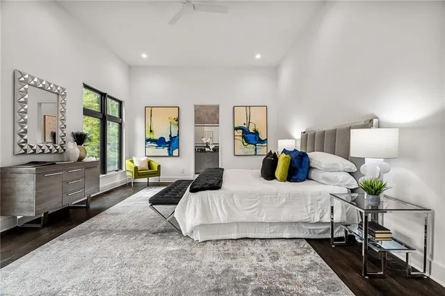 a bedroom with a large bed and a couch