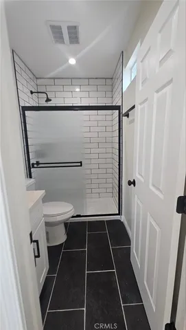 a view of a kitchen from a hallway