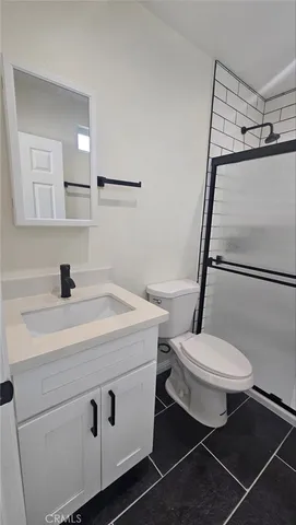 a view of a room with wooden floor and white walls