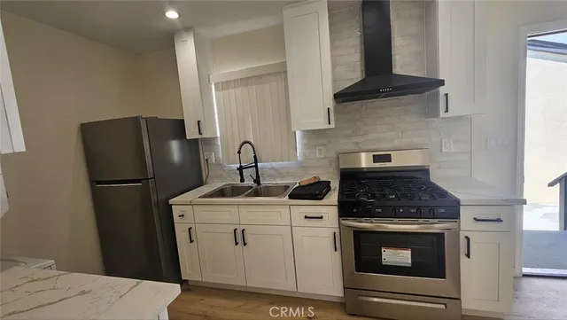 a bathroom with a toilet a sink and shower