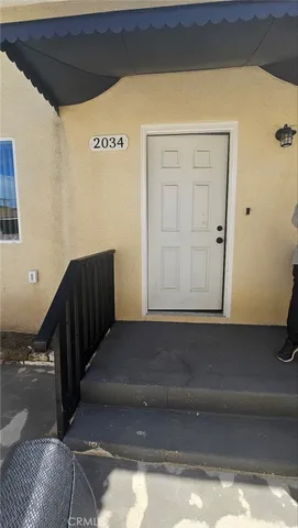 a kitchen with granite countertop a sink stove and refrigerator