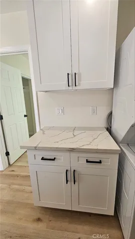 a kitchen with a sink and a stove top oven