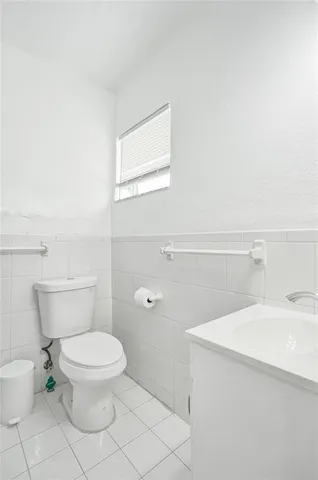 a bathroom with a sink vanity and mirror
