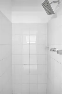 a bathroom with a granite countertop sink toilet and mirror