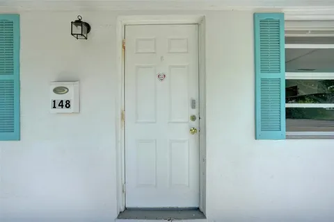 a bedroom with furniture and window
