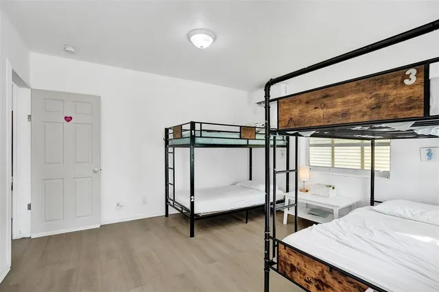 a kitchen with a stove a sink and a window