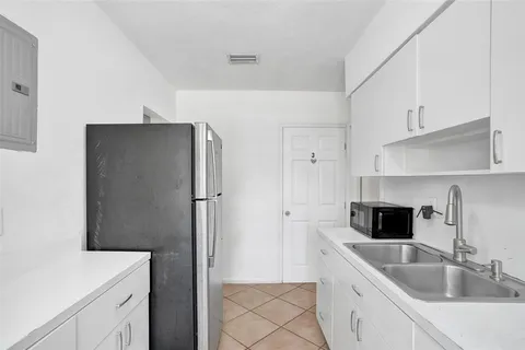 a bathroom with a shower and mirror