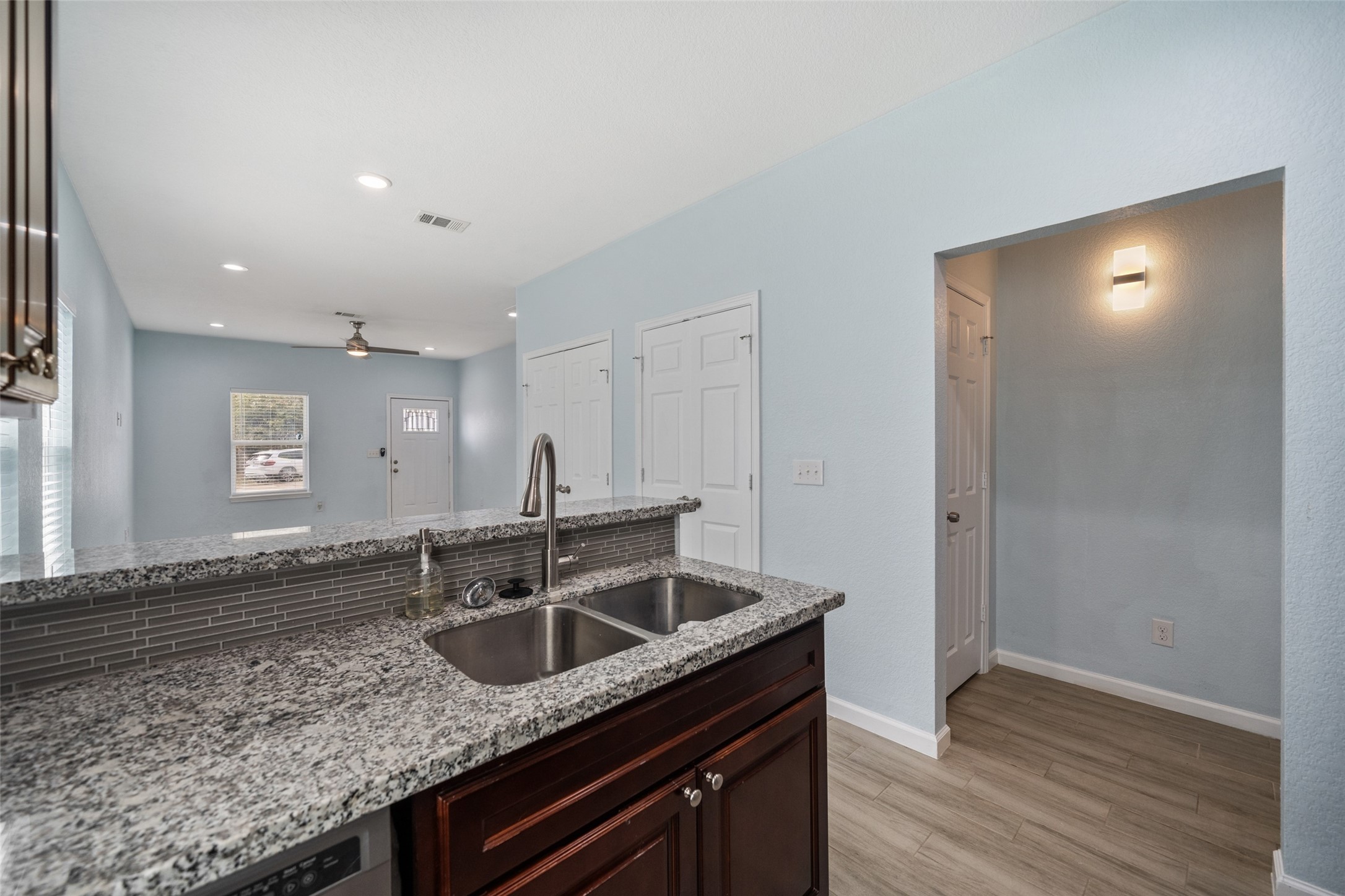 241 Ridgeside Court Montgomery, TX 77316 - Photo 12 of 30 a kitchen with stainless steel appliances granite countertop a sink and cabinets