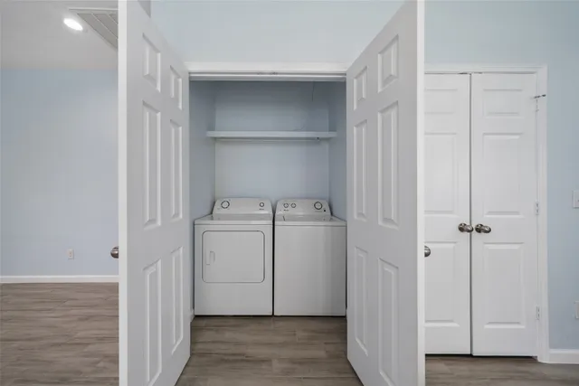 a view of a storage & utility room with a washer dryer