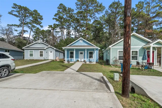 a view of house with outdoor space and view of house
