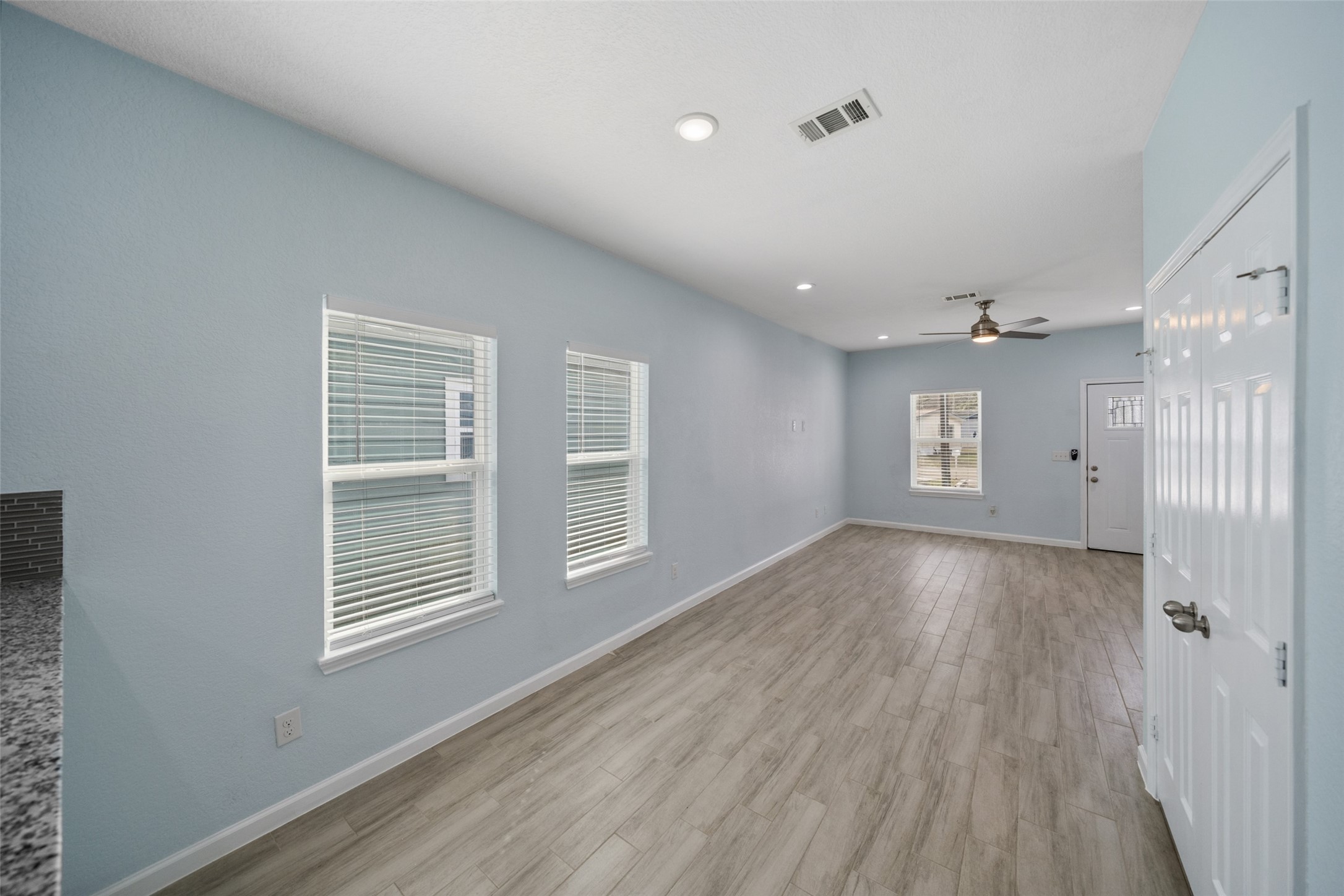 241 Ridgeside Court Montgomery, TX 77316 - Photo 5 of 30 a view of an empty room with wooden floor and a window