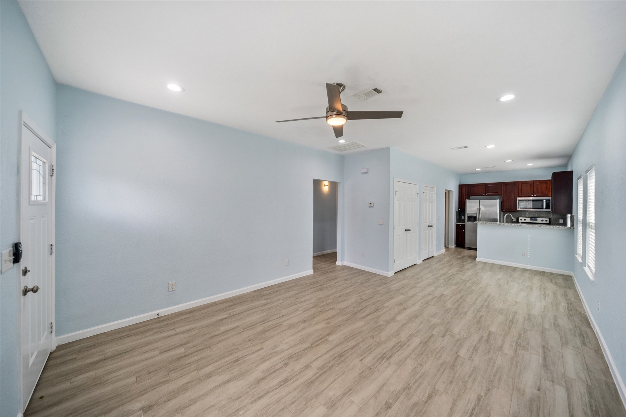 241 Ridgeside Court Montgomery, TX 77316 - Photo 9 of 30 a view of empty room with wooden floor