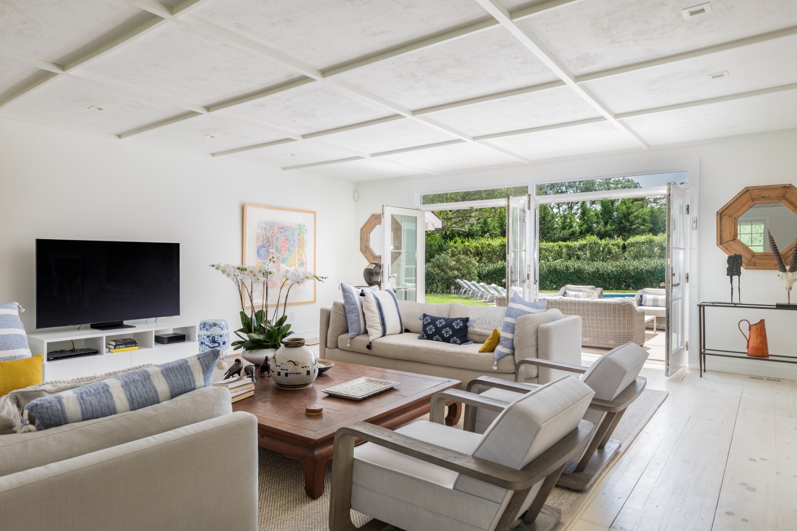 227 Sagaponack Road Bridgehampton, NY 11932 - Photo 13 of 26 a living room with furniture and a flat screen tv