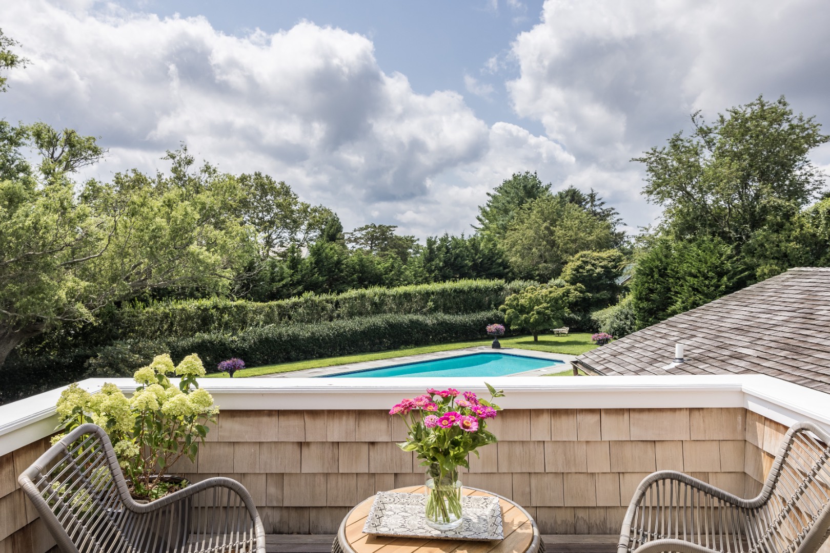 227 Sagaponack Road Bridgehampton, NY 11932 - Photo 20 of 26 a view of a patio with couches table and chairs and potted plants