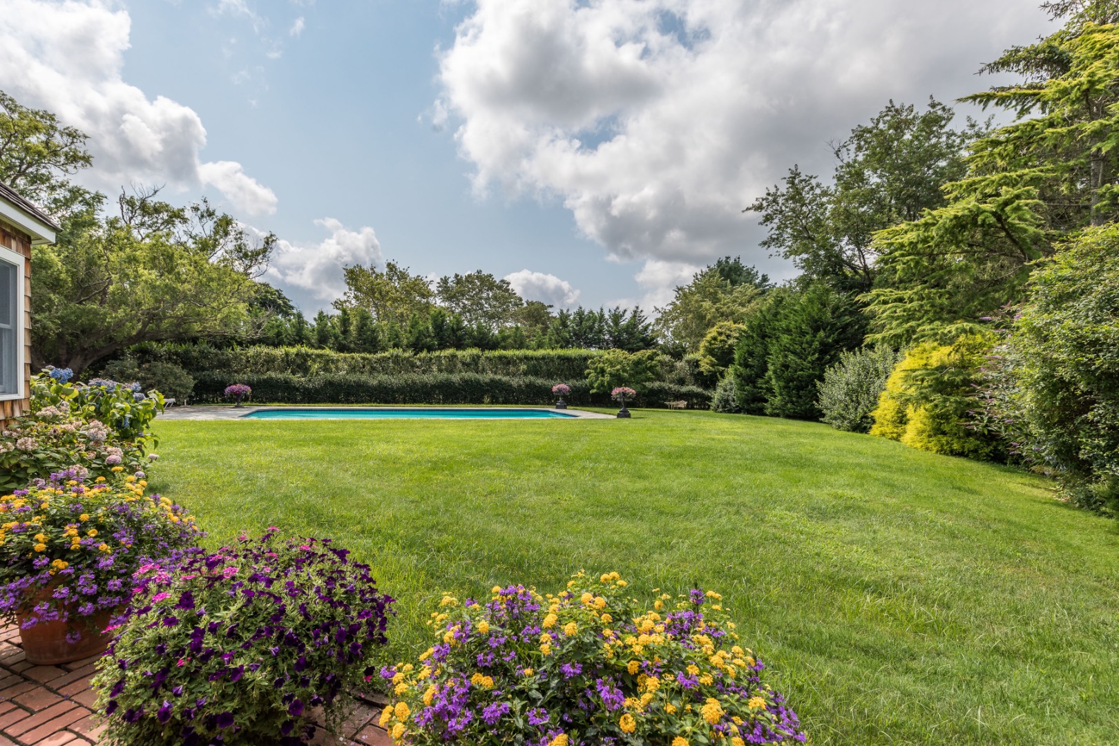 227 Sagaponack Road Bridgehampton, NY 11932 - Photo 3 of 26 a view of a garden with flowers and trees