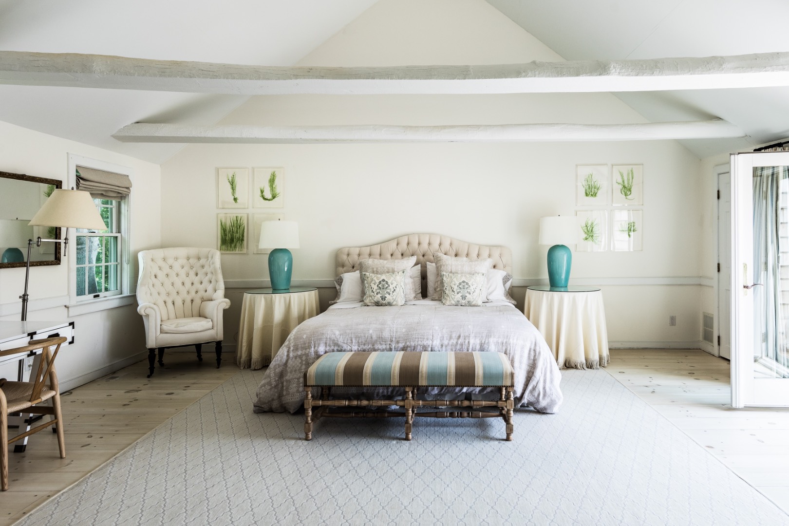 227 Sagaponack Road Bridgehampton, NY 11932 - Photo 21 of 26 a spacious bedroom with a bed and a couch