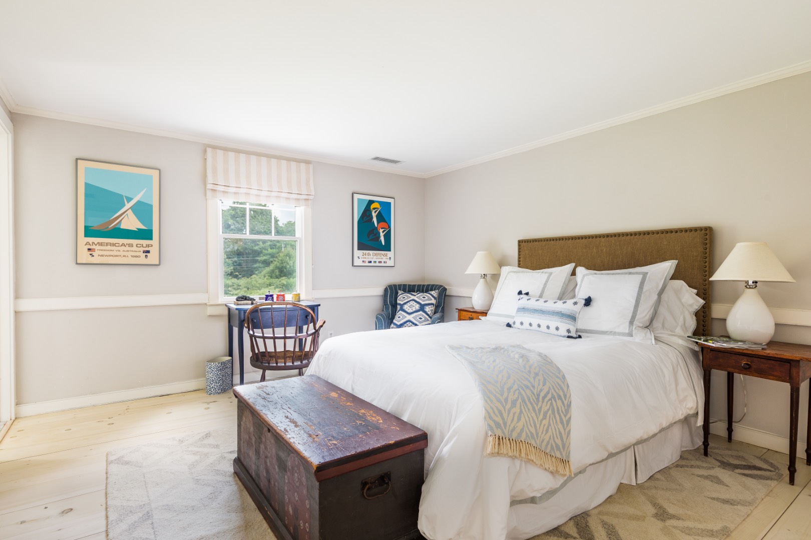 227 Sagaponack Road Bridgehampton, NY 11932 - Photo 23 of 26 a bedroom with a bed and a table with window
