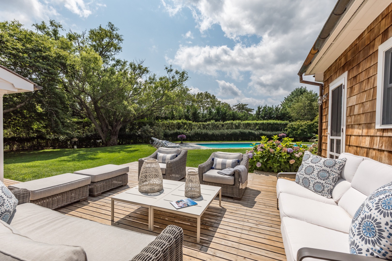 227 Sagaponack Road Bridgehampton, NY 11932 - Photo 25 of 26 a view of a patio with couches chairs and a yard