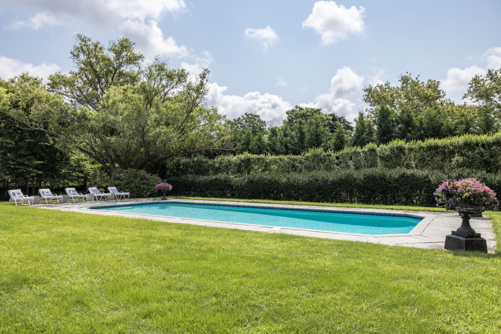 227 Sagaponack Road Bridgehampton, NY 11932 - Photo 7 of 26 a view of a swimming pool and a yard