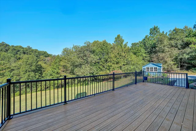 a view of a porch with chairs and backyard