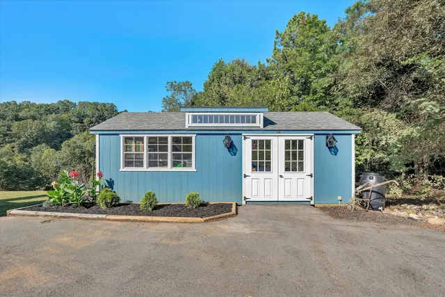 a view of a swimming pool with a yard