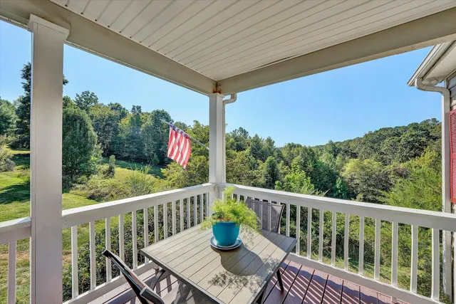 a view of a balcony with chairs