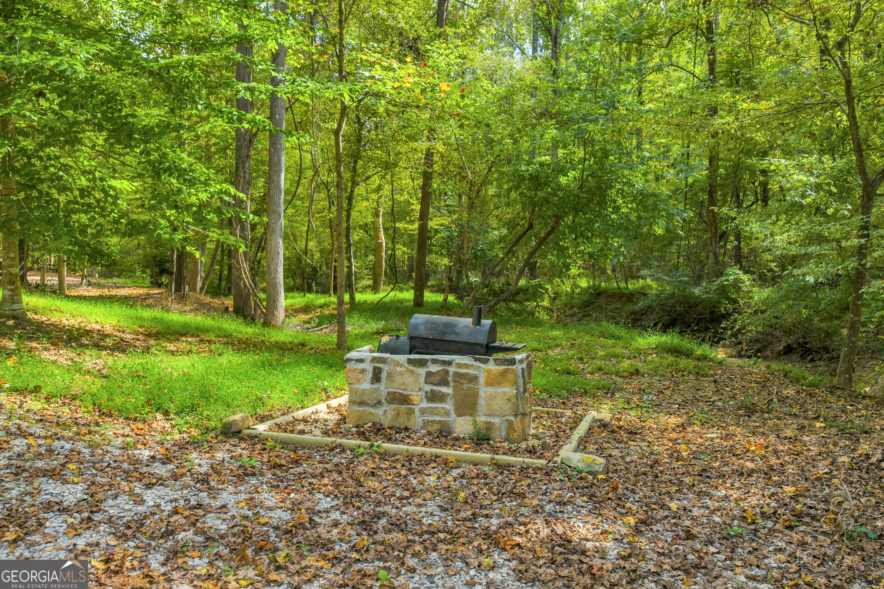1542 Silver Hill Road Stone Mountain, GA 30087 - Photo 23 of 40 a view of a garden with a bench