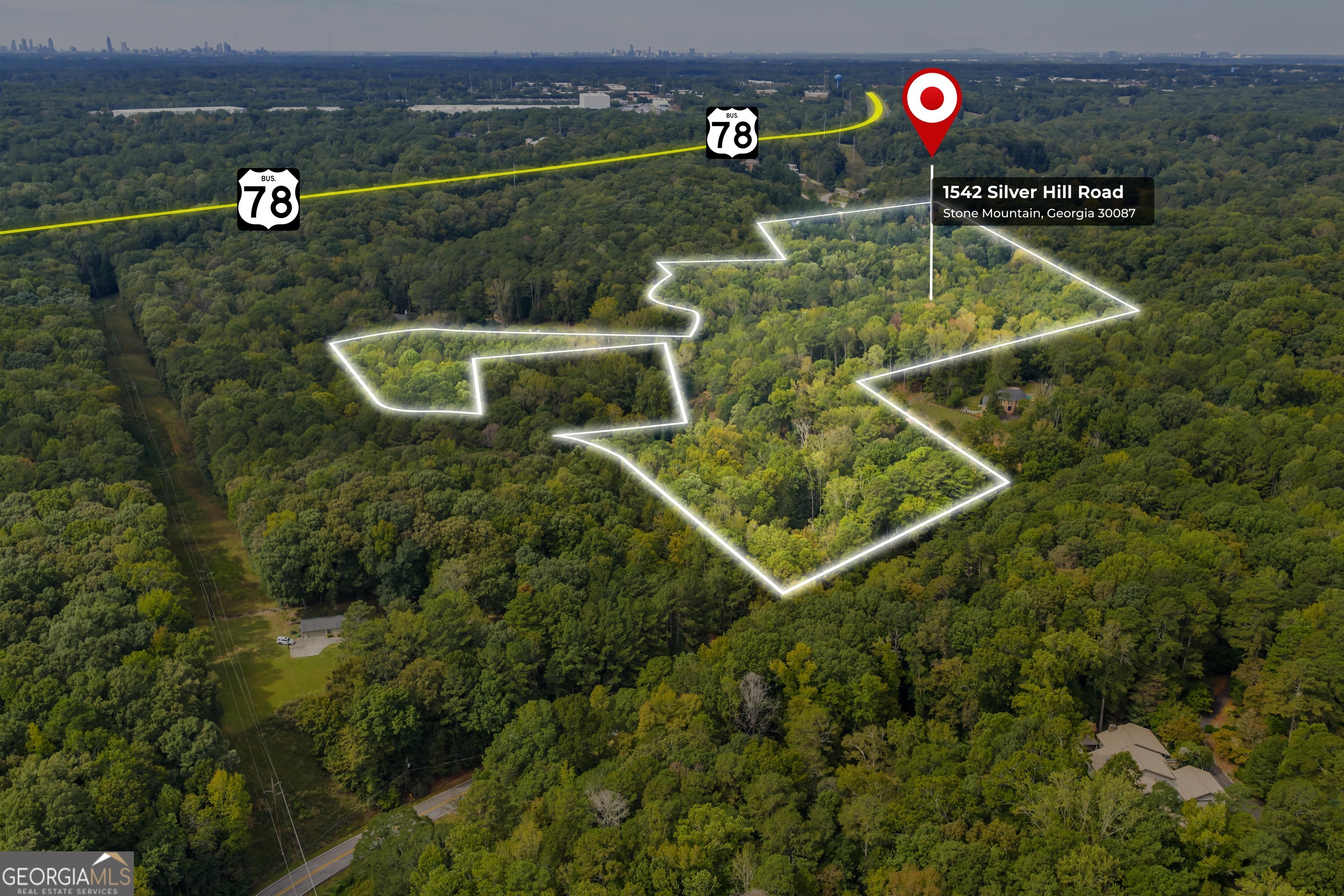 1542 Silver Hill Road Stone Mountain, GA 30087 - Photo 3 of 40 an aerial view of house with a swimming pool