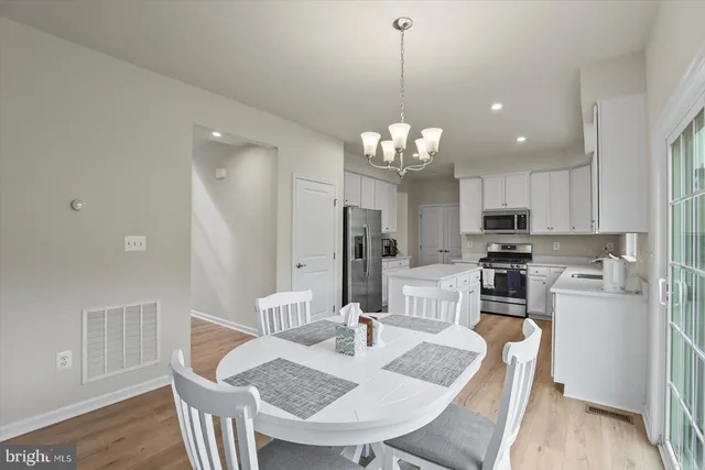 a living room with furniture a lamp and a window
