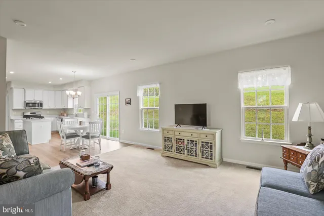 a bathroom with a toilet a sink and a mirror