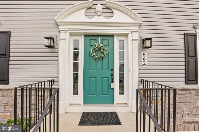 a view of a door and a window of the house