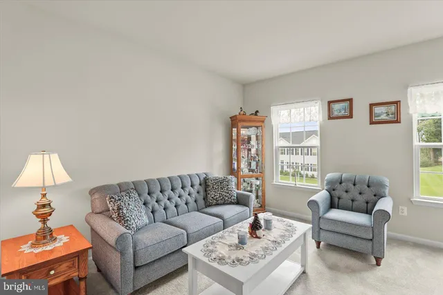 a spacious bedroom with a bed and a window