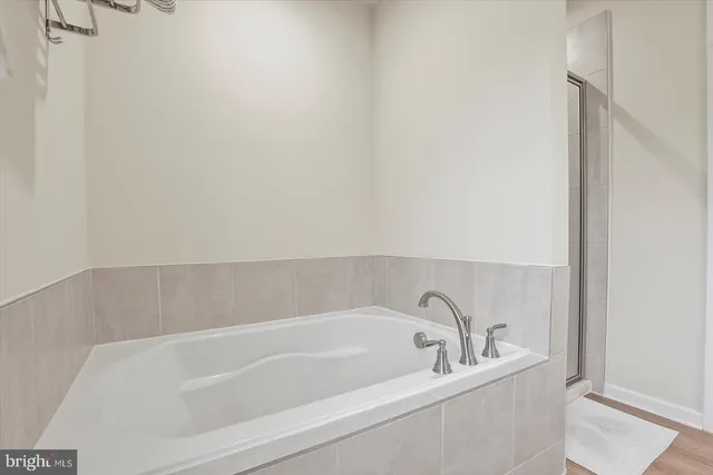 a bed room with a bed and a window