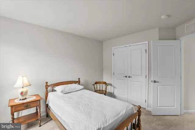 a living room with furniture and white walls